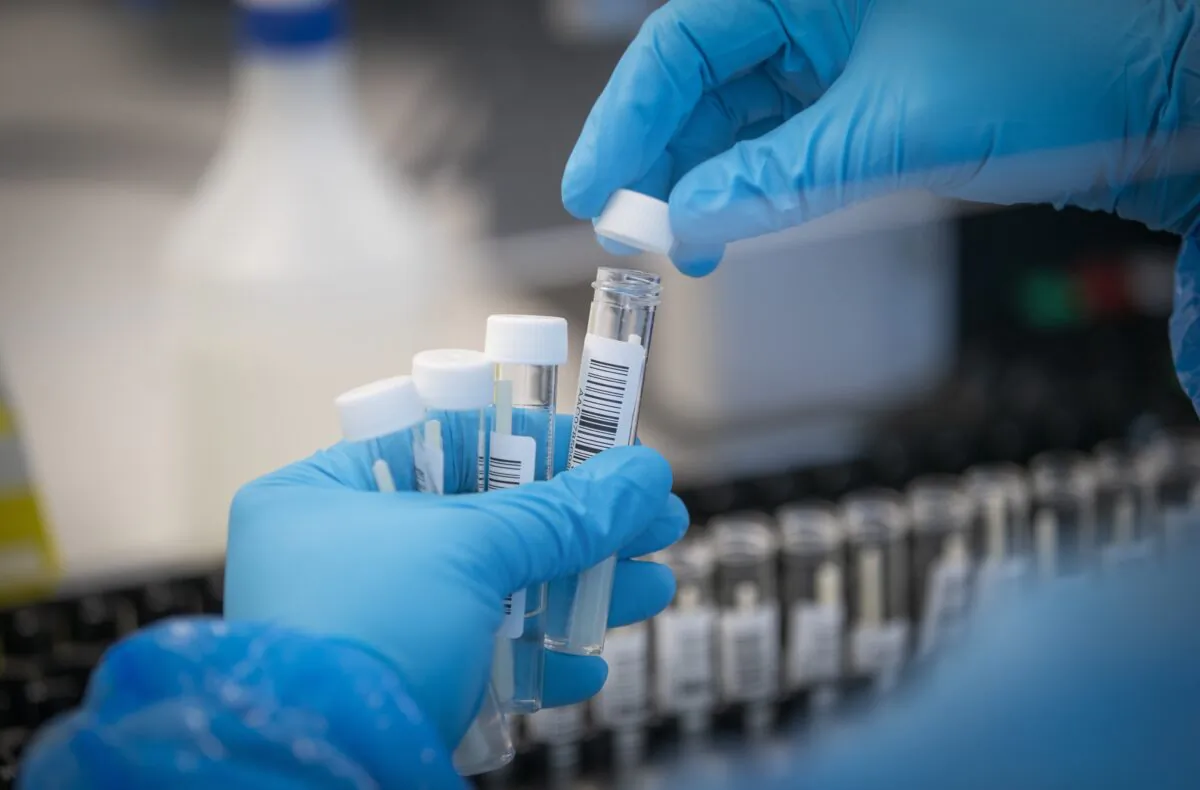 Patient samples are transferred by scientists into plates before entering the PCR (Polymerase Chain Reaction) process for COVID-19 testing at the Glasgow Lighthouse coronavirus testing facility, in Glasgow, UK, in an undated file photo. (Jane Barlow/PA)
