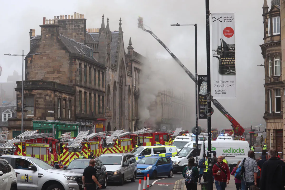 Firefighters at the scene of a large fire at George IV Bridge in Edinburgh, UK, on Aug. 24, 2021. Picture taken with permission from the twitter feed of Matt Donlan. (Matt Donlan/Twitter/PA)