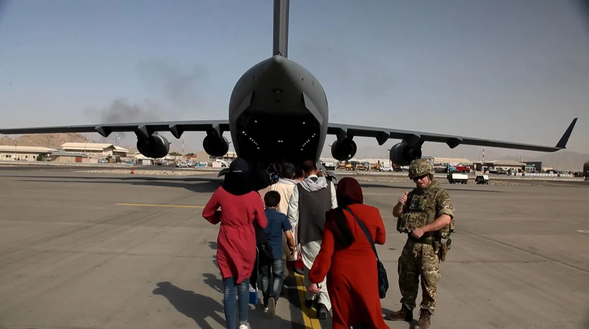 Captain Muraal at Kabul airport as she boards a British military plane to be evacuated to the UK from Afghanistan, in an undated handout photo. (Ministry of Defence/PA)