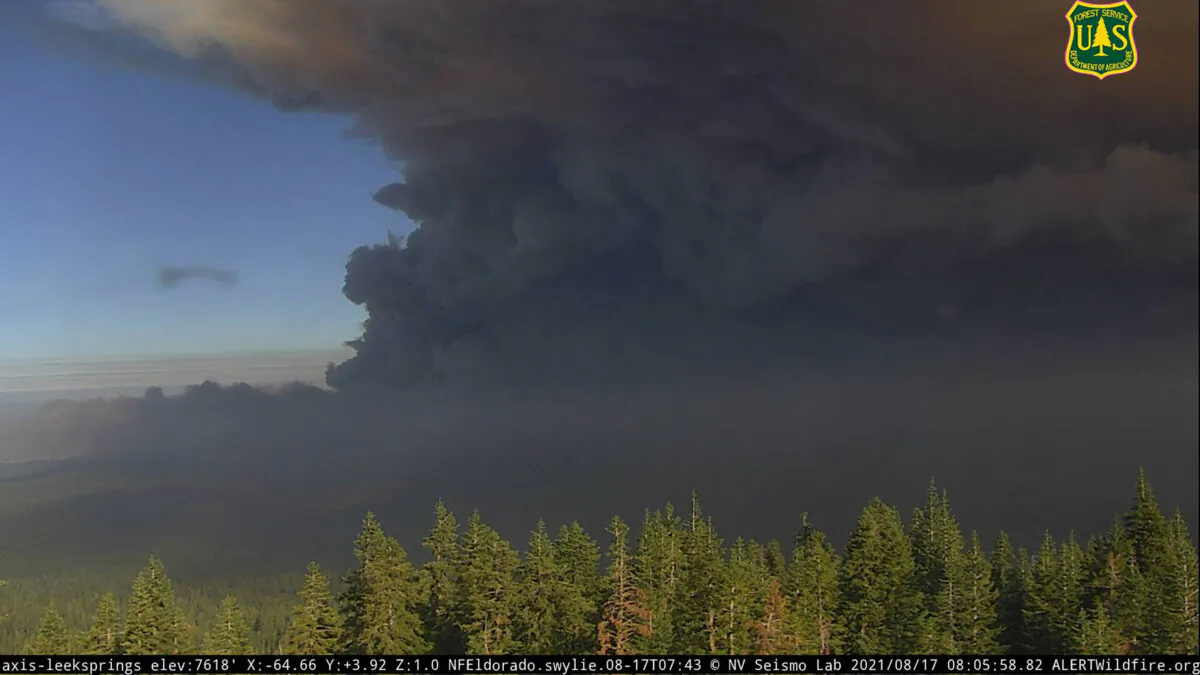 A thick plume of smoke from the Caldor fire, as captured on a U.S. Forest Service wildfire monitoring camera shortly after 8 a.m. on Aug. 17, 2021. (U.S. Forest Service via Alertwildfire Network/TNS)