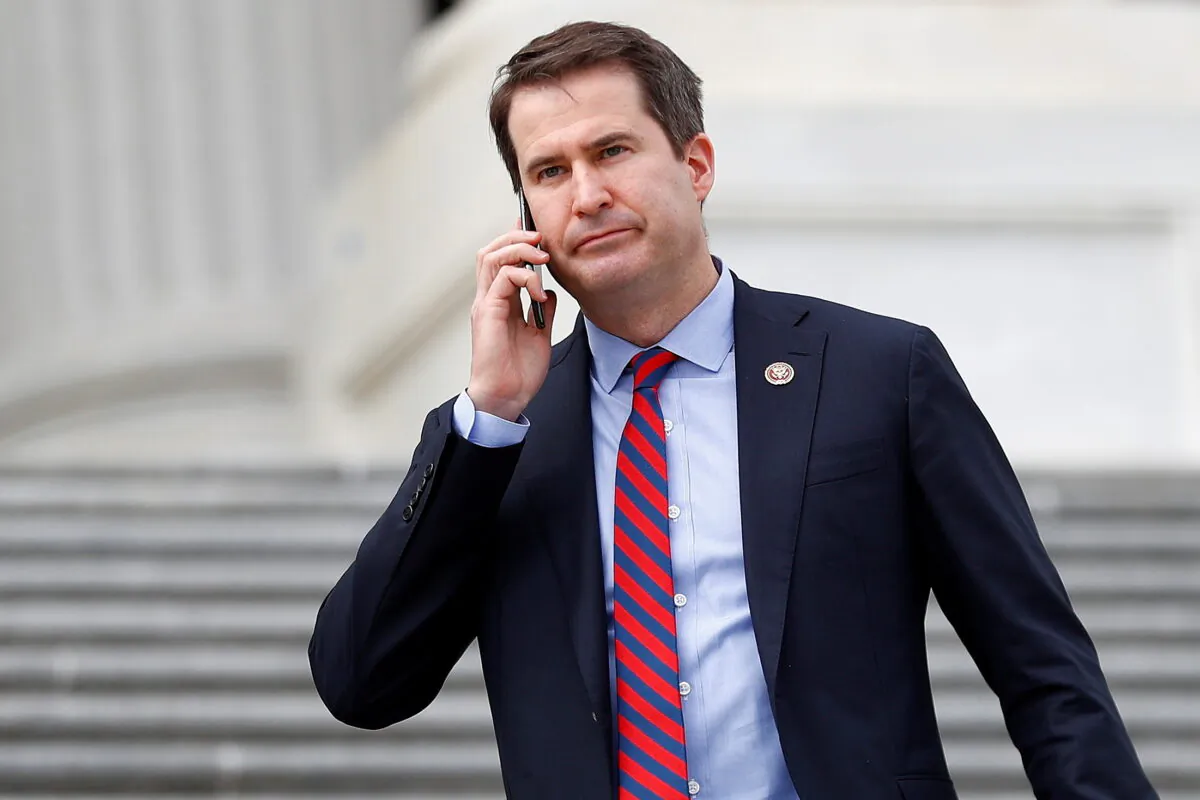 Rep. Seth Moulton (D-Mass.) descends the House entrance stairs following the Friends of Ireland reception on Capitol Hill in Washington on March 12, 2020. (Tom Brenner/Reuters)