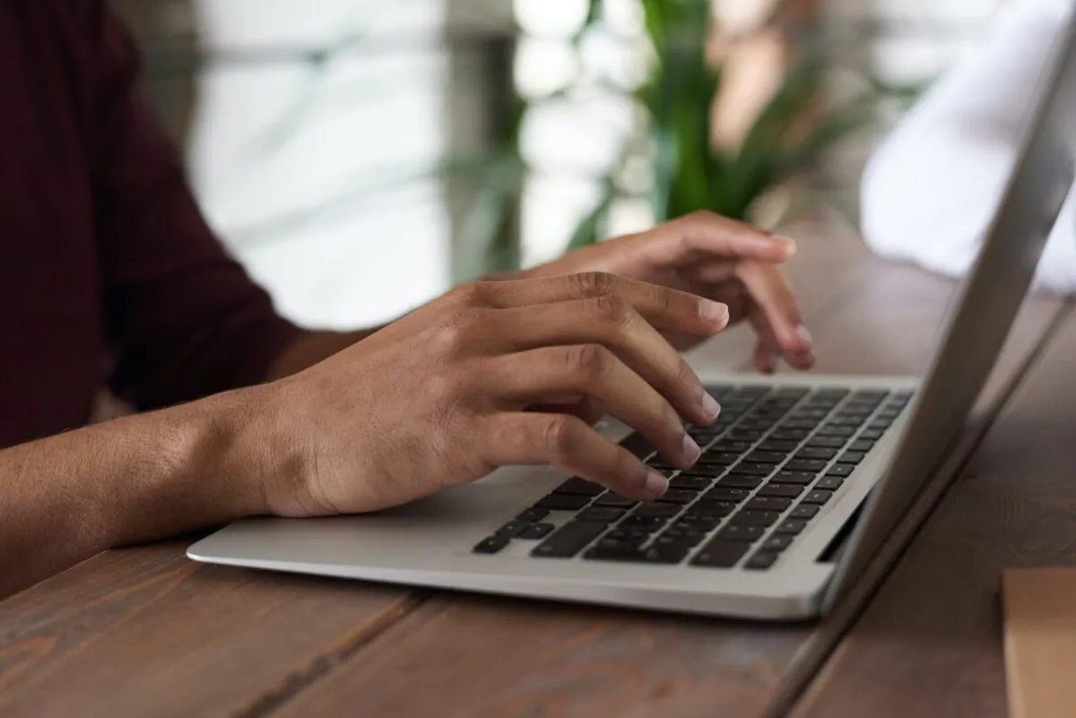 A person using laptop. (Fauxels/Pexels)