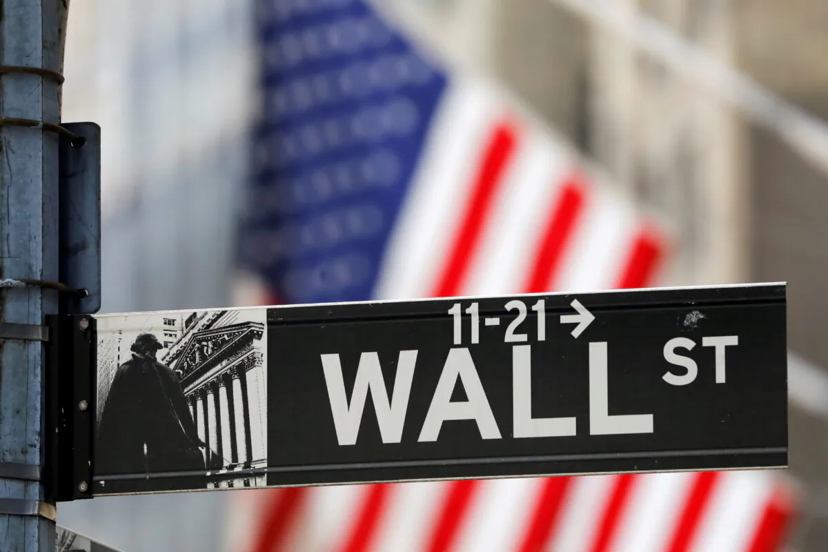 A street sign for Wall Street is seen outside the New York Stock Exchange (NYSE) in New York City, N.Y., on July 19, 2021. (Andrew Kelly/Reuters)
