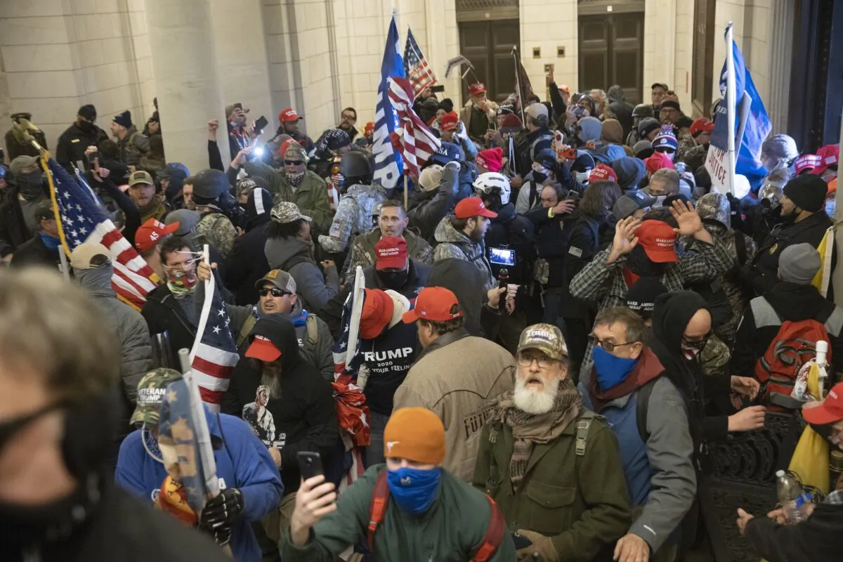 Protesters supporting U.S. President Donald Trump gather near the east front door of the U.S. Capitol after groups breached the building's security in Washington on Jan. 06, 2021. (Win McNamee/Getty Images)