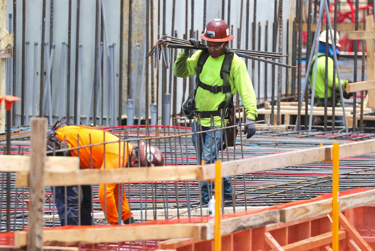 Construction workers are seen at work in Fort Lauderdale, Fla., on May 3, 2019. (Joe Raedle/Getty Images)