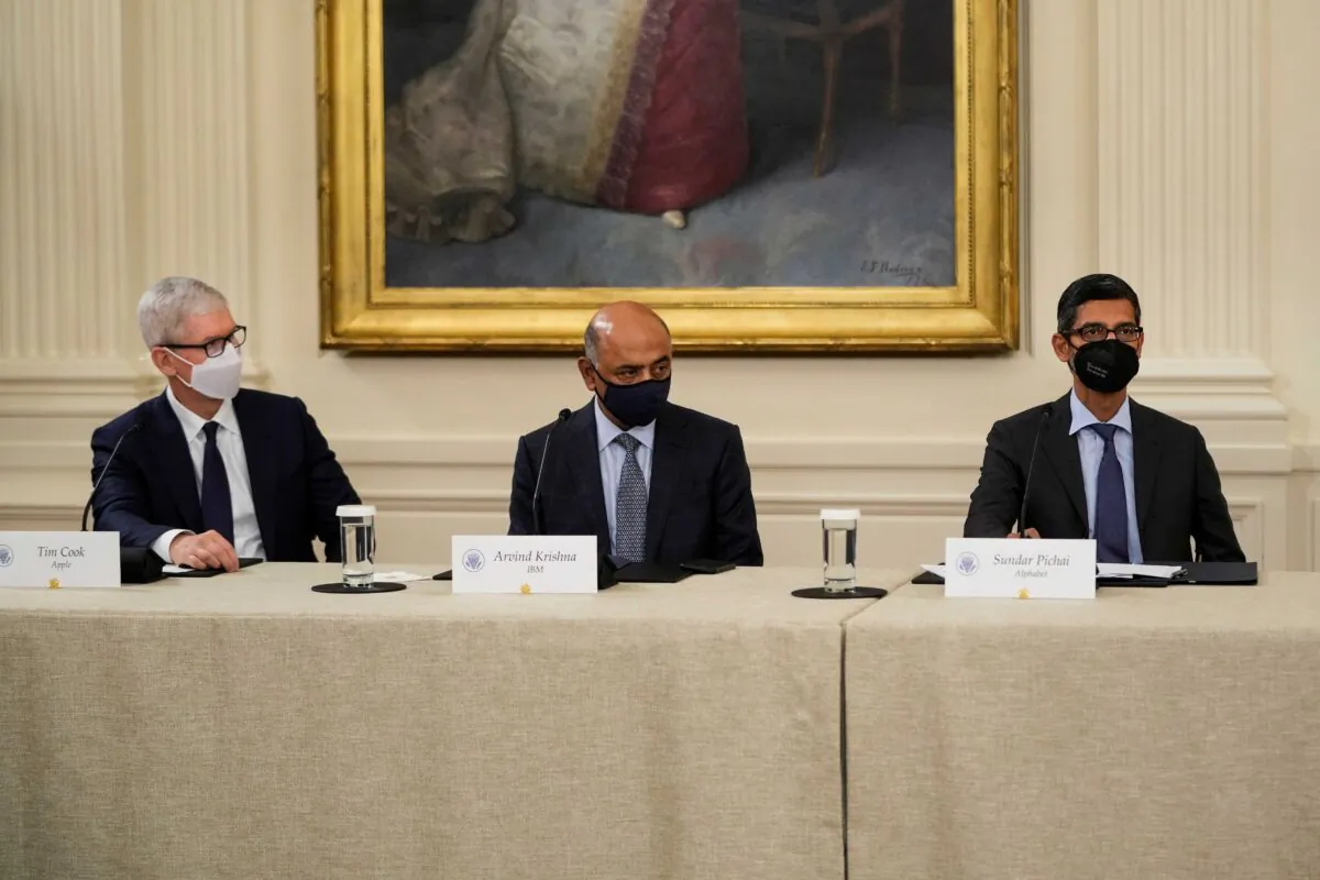 (L-R) Apple CEO Tim Cook, IBM CEO Arvind Krishna, and Google CEO Sundar Pichai listen as U.S. President Joe Biden speaks during a meeting about cybersecurity in the East Room of the White House on Aug. 25, 2021. (Drew Angerer/Getty Images)