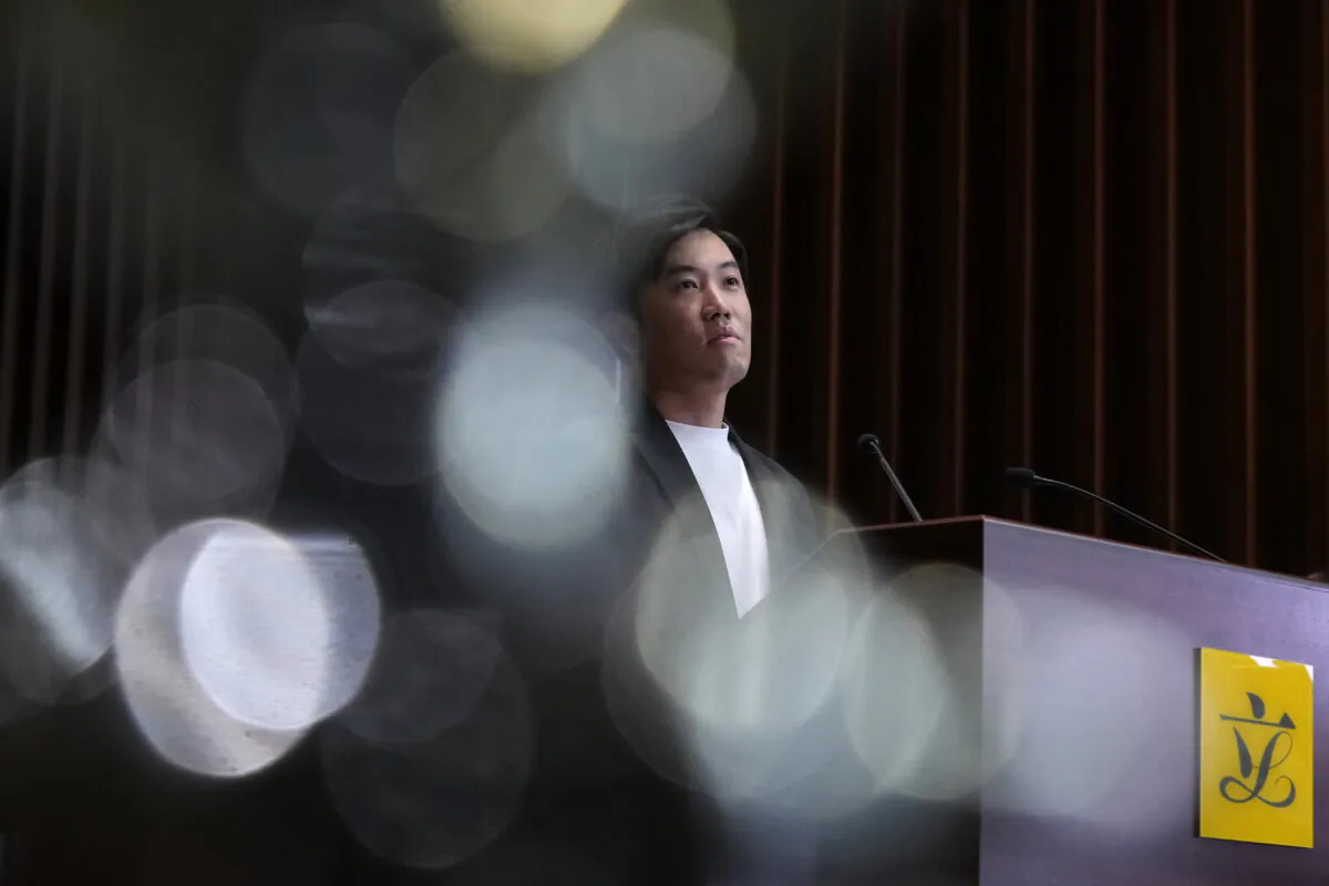 Lawmaker Cheng Chung-Tai pauses during a press conference after being disqualified from the legislature in Hong Kong, on Aug. 26, 2021. (Vincent Yu/AP Photo)