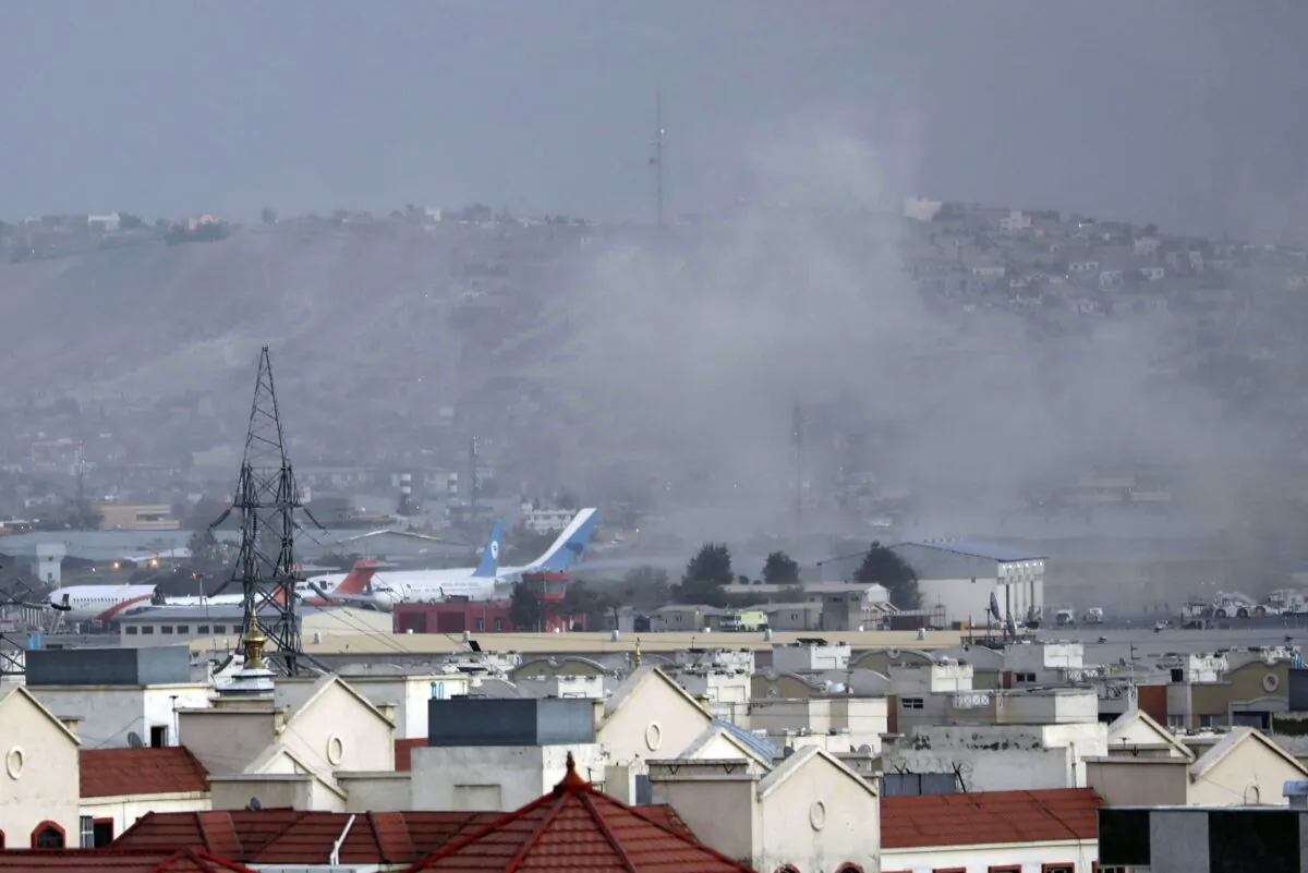 Smoke rises from a deadly explosion outside the airport in Kabul, Afghanistan, on Aug. 26, 2021. (Wali Sabawoon/AP Photo)