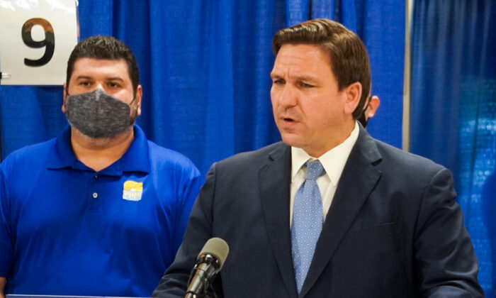 Florida Gov. Ron DeSantis speaks to reporters during a press conference opening up an infusion site in Charlotte County, Fla. (Jann Falkenstern/The Epoch Times)