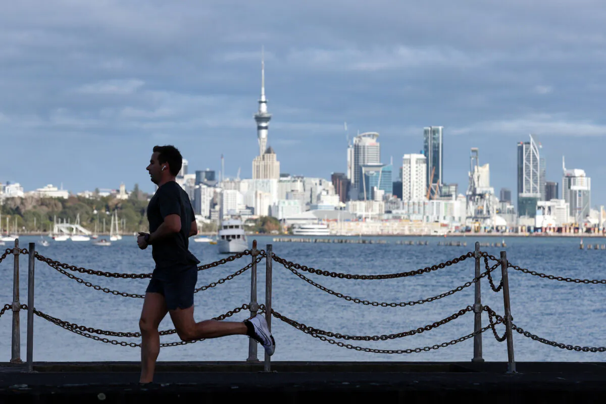 A runner exercises along Tamaki Drive on Auckland's waterfront in Auckland, New Zealand, on Aug. 24, 2021. (Fiona Goodall/Getty Images)