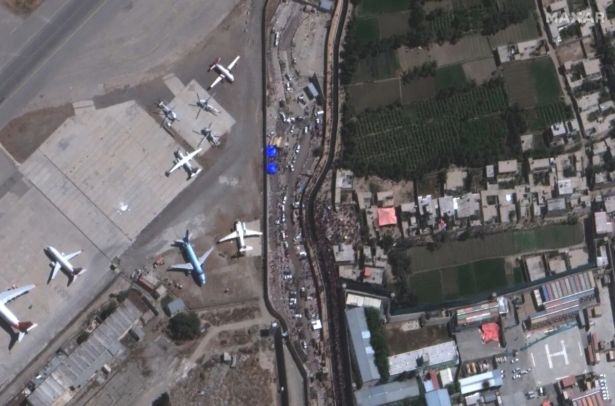 An overview of crowds at the Abbey Gate at Hamid Karzai International Airport, in Kabul, Afghanistan on Aug. 24, 2021, in this satellite image obtained by Reuters on Aug. 26, 2021. (Satellite image 2021 Maxar Technologies/Handout via Reuters)