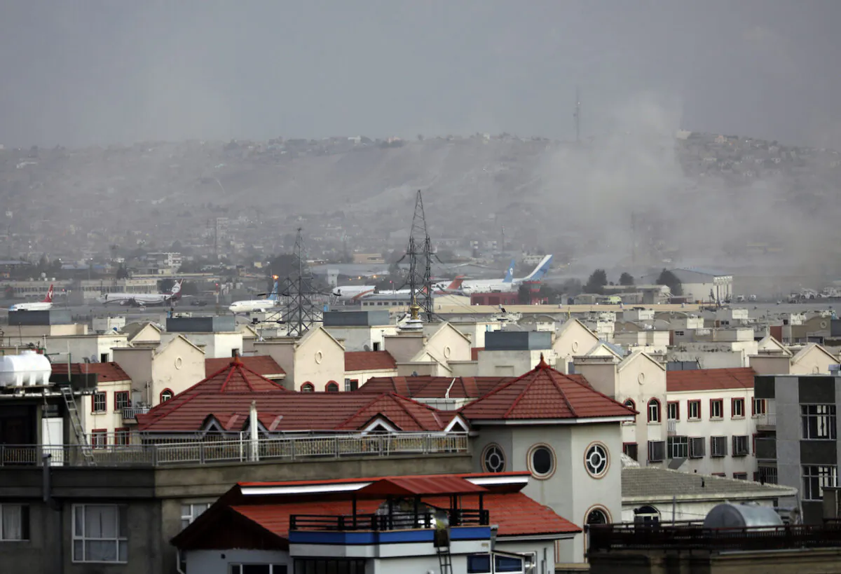 Smoke rises from explosion outside the airport in Kabul, Afghanistan, on Aug. 26, 2021. (AP Photo/Wali Sabawoon)