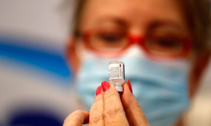 Health worker prepares a dose of a vaccine in the Israeli town of Rishon Lezion, on Aug. 13, 2021. (Ahmad Gharabli/AFP via Getty Images)
