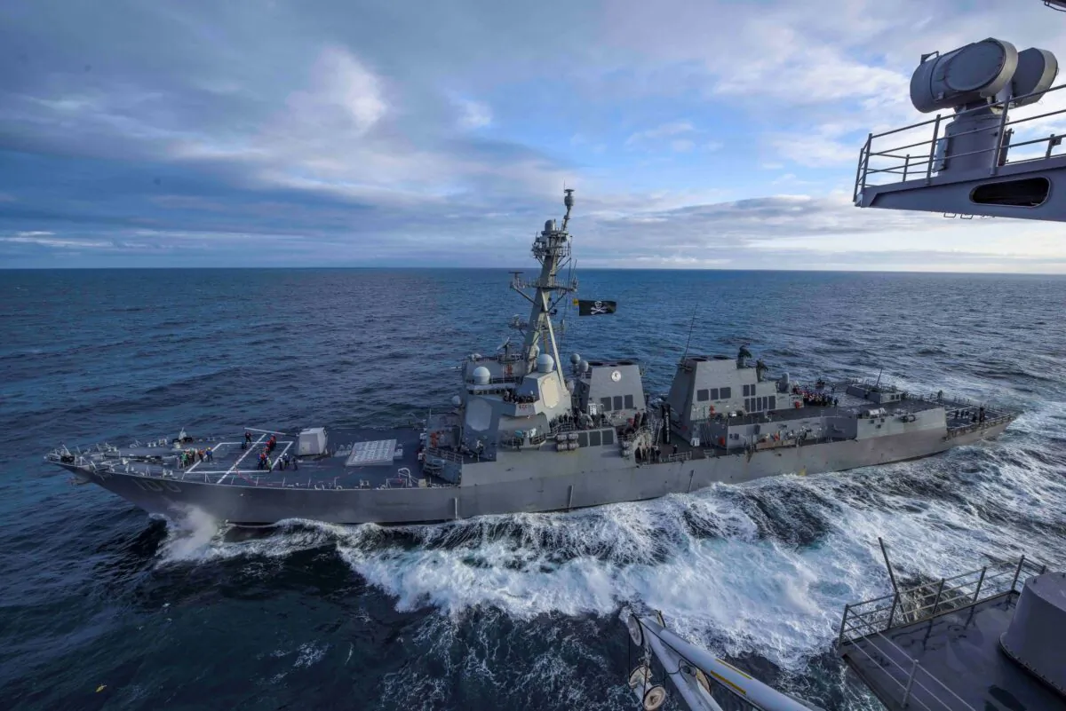 The U.S. Navy Arleigh Burke-class guided missile destroyer USS Kidd transits alongside the aircraft carrier USS Theodore Roosevelt while participating in Exercise Northern Edge 2019 in the Gulf of Alaska, on May 16, 2019. (U.S. Navy/Mass Communication Specialist 3rd Class Sean Lynch/File Photo/Handout via Reuters)