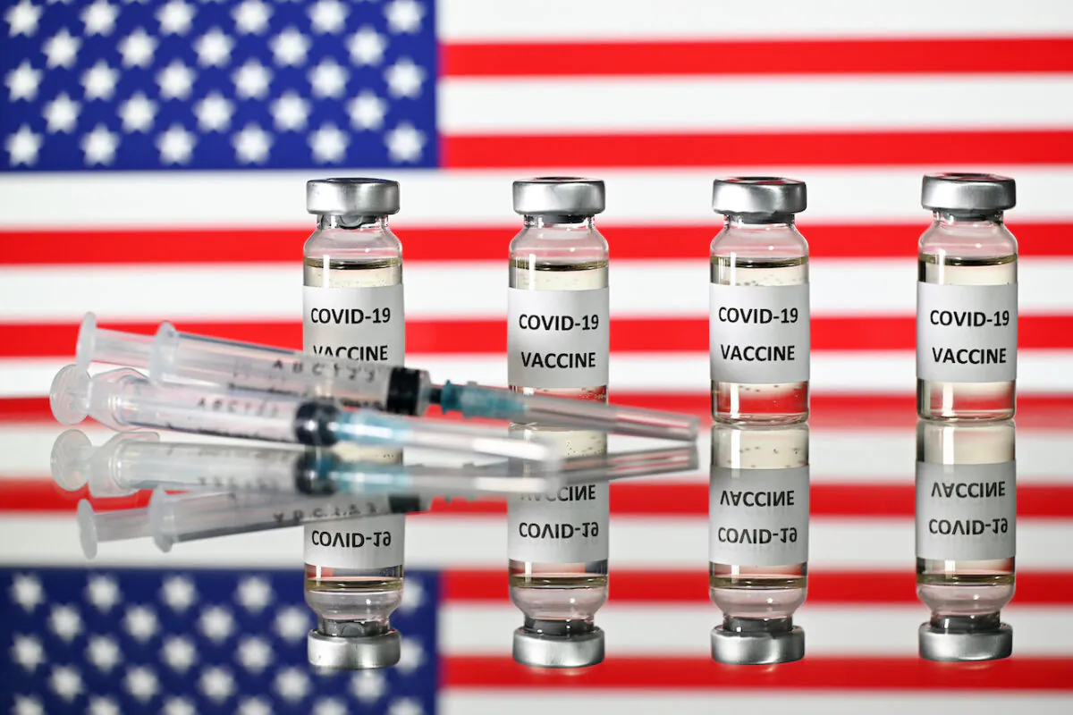 An illustration picture of COVID-19 vaccine vials with a flag of the United States. (Justin Tallis/AFP via Getty Images)