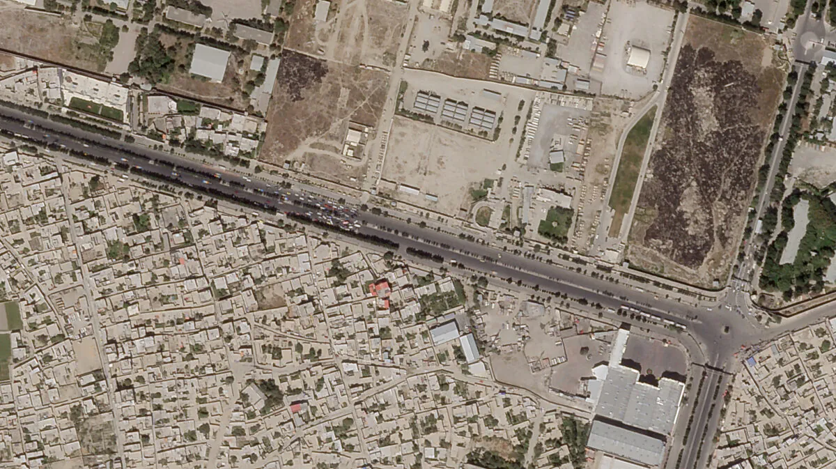 In this satellite photo taken by Planet Labs Inc., a Taliban checkpoint is seen blocking access just south of Kabul's international airport, in Afghanistan, on Aug. 28, 2021. (Planet Labs Inc. via AP)