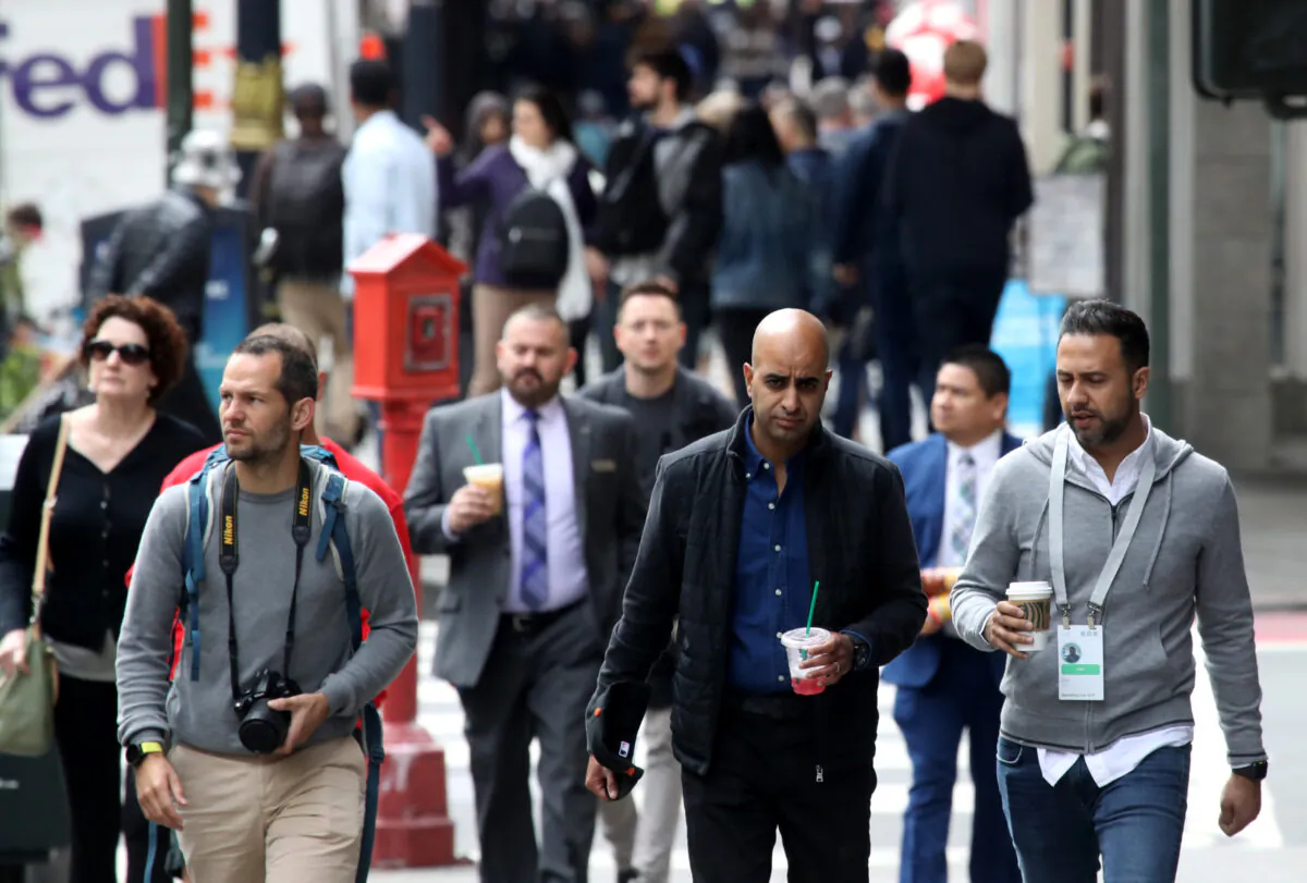 Pedestrians walk along Powell Street in San Francisco on May 14, 2019. (Justin Sullivan/Getty Images)