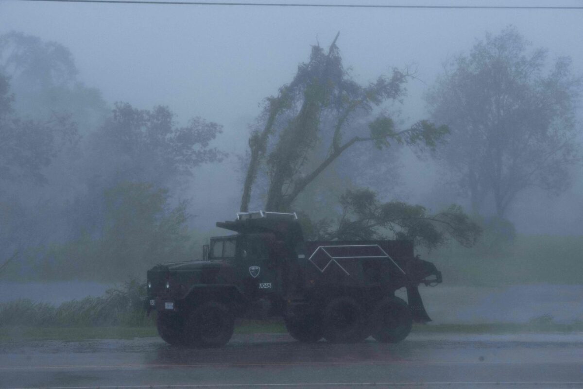 A truck is seen in heavy winds and rain from hurricane Ida in Bourg, La., on Aug. 29, 2021. (MARK FELIX/AFP via Getty Images)