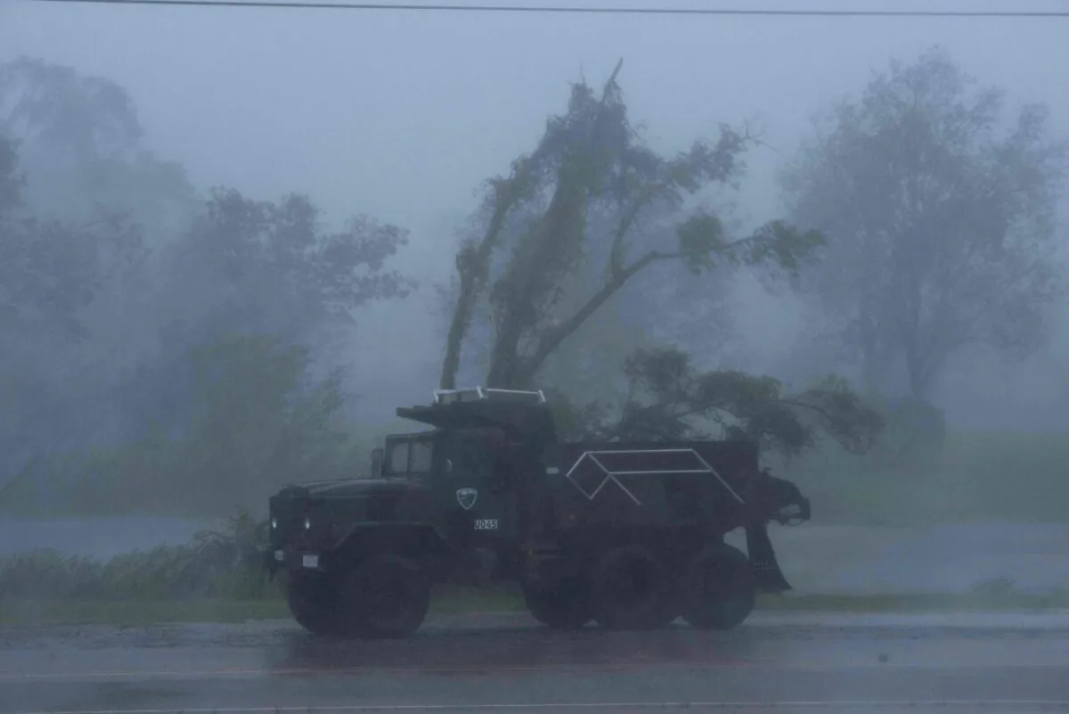 A truck is seen in heavy winds and rain from Hurricane Ida in Bourg, La., on Aug. 29, 2021. (Mark Felix/AFP via Getty Images)