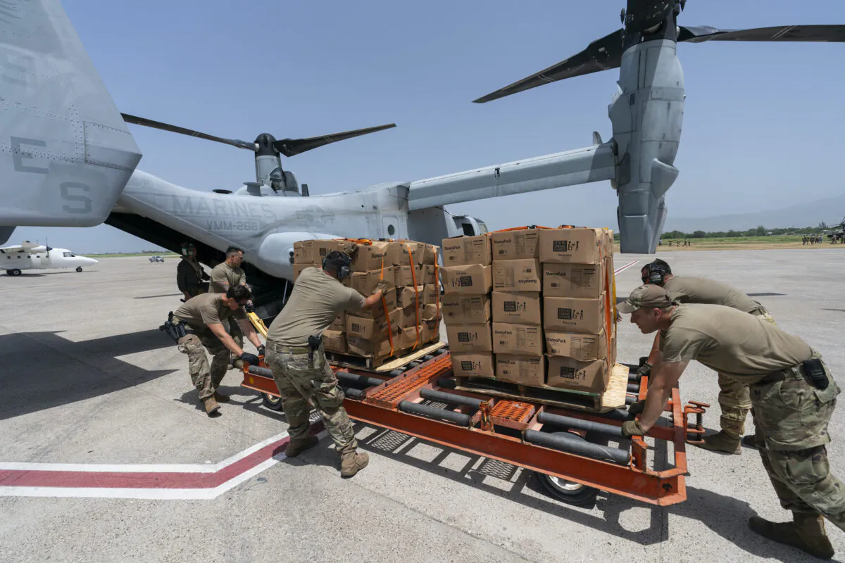 Food is loaded onto a VM-22 Osprey at Toussaint Louverture International Airport in Port-au-Prince, Haiti, on Aug. 28, 2021. (Alex Brandon/AP Photo)