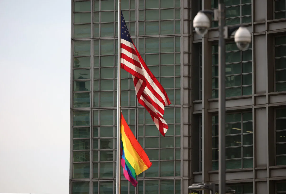 The rainbow flag is hanging next to the US national flag over the entrance to the the US embassy in Moscow on June 25, 2021. (Dimitar Dilkoff/AFP via Getty Images)
