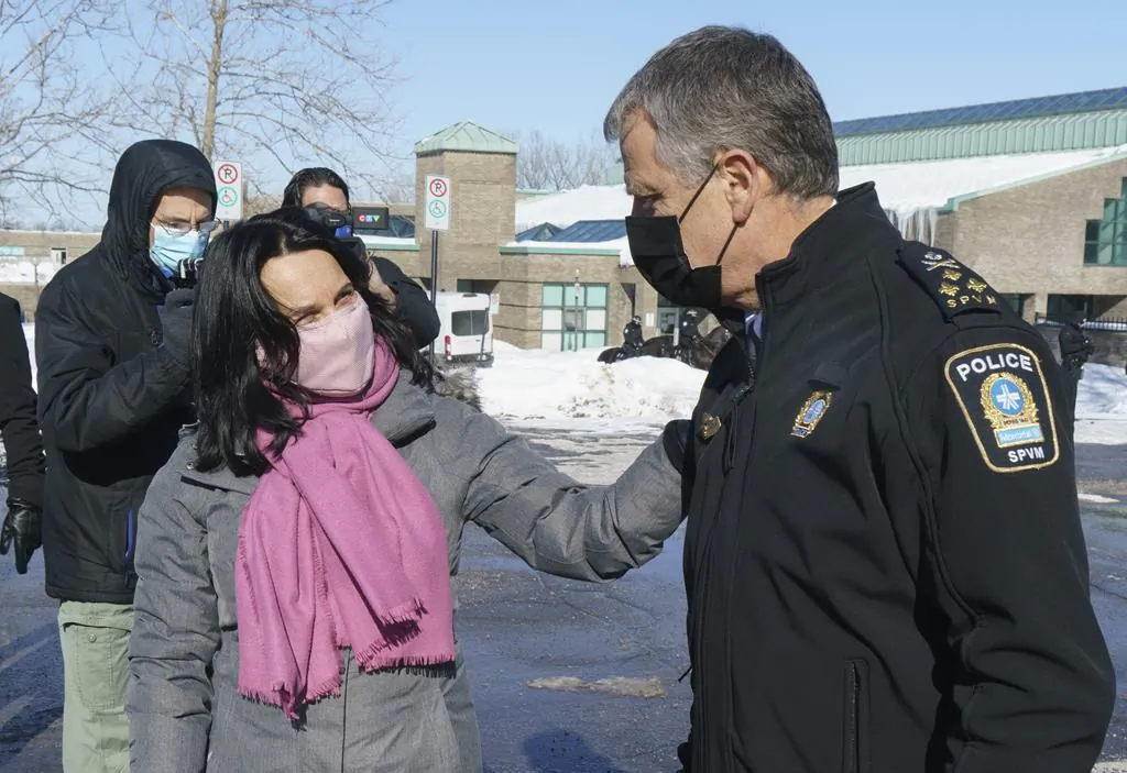 Montreal Mayor Valerie Plante and Police Chief Sylvain Caron chat following a news conference in Montreal on February 11, 2021. (The Canadian Press/Paul Chiasson)