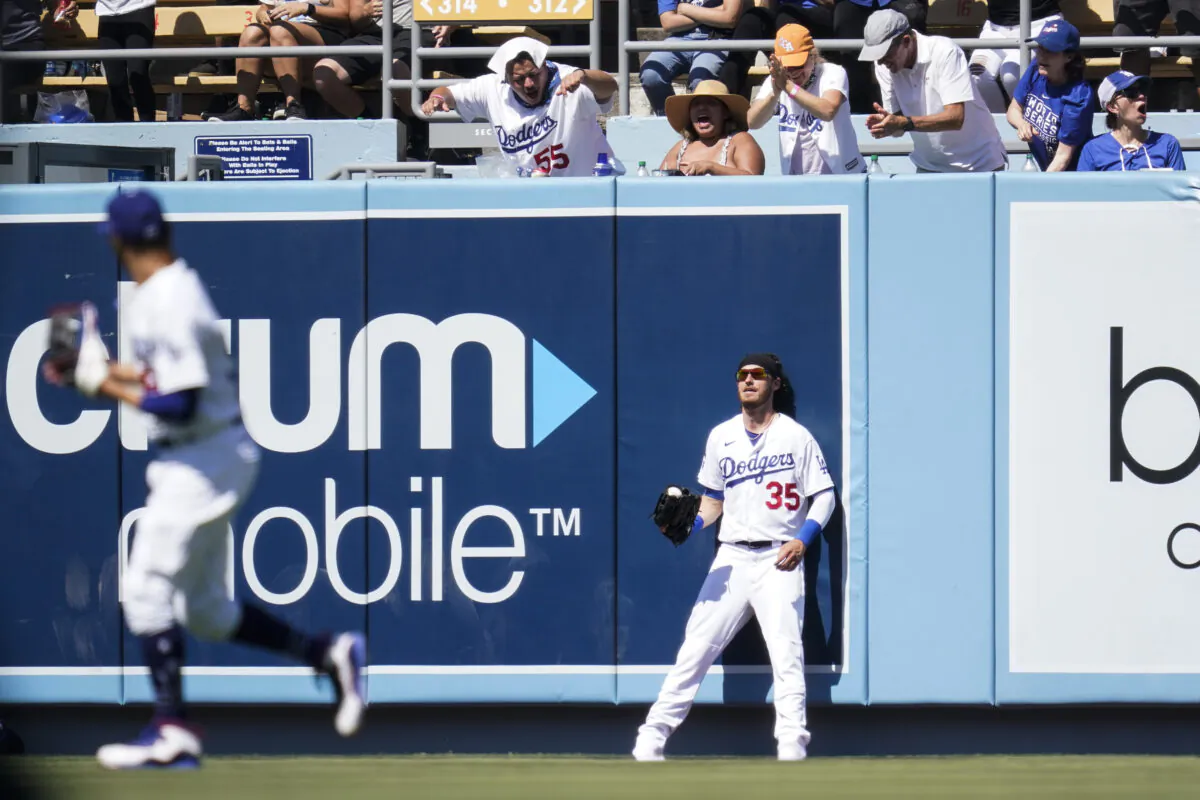 Los Angeles Dodgers center fielder Cody Bellinger (35) reacts after catching a line drive hit by Colorado Rockies' Connor Joe during the sixth inning of a baseball game in Los Angeles on Aug. 29, 2021. (AP Photo/Ashley Landis)