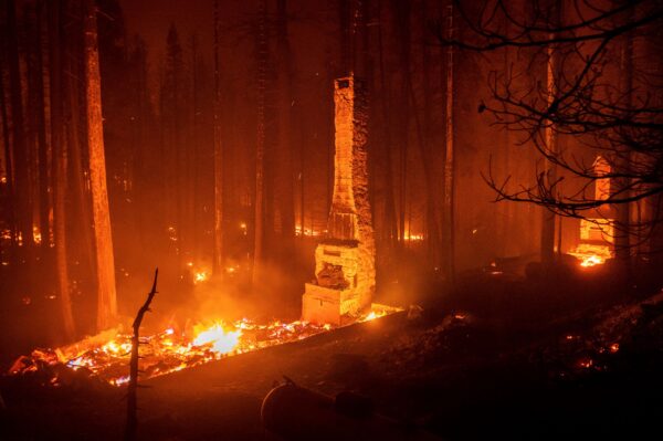 chimneys stand by the Caldor Fire