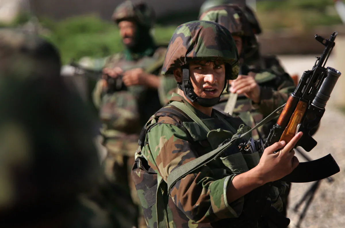 Afghan Army soldiers patrol in Kajaki, Helmand province, Afghanistan, on March 14, 2007. (John Moore/Getty Images)
