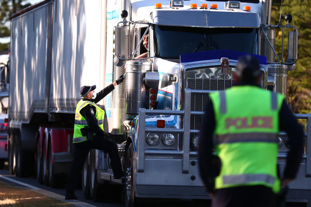 Queensland Police stop trucks at the Queensland border in Coolangatta, Australia, on Aug. 25, 2021 (Chris Hyde/Getty Images)
