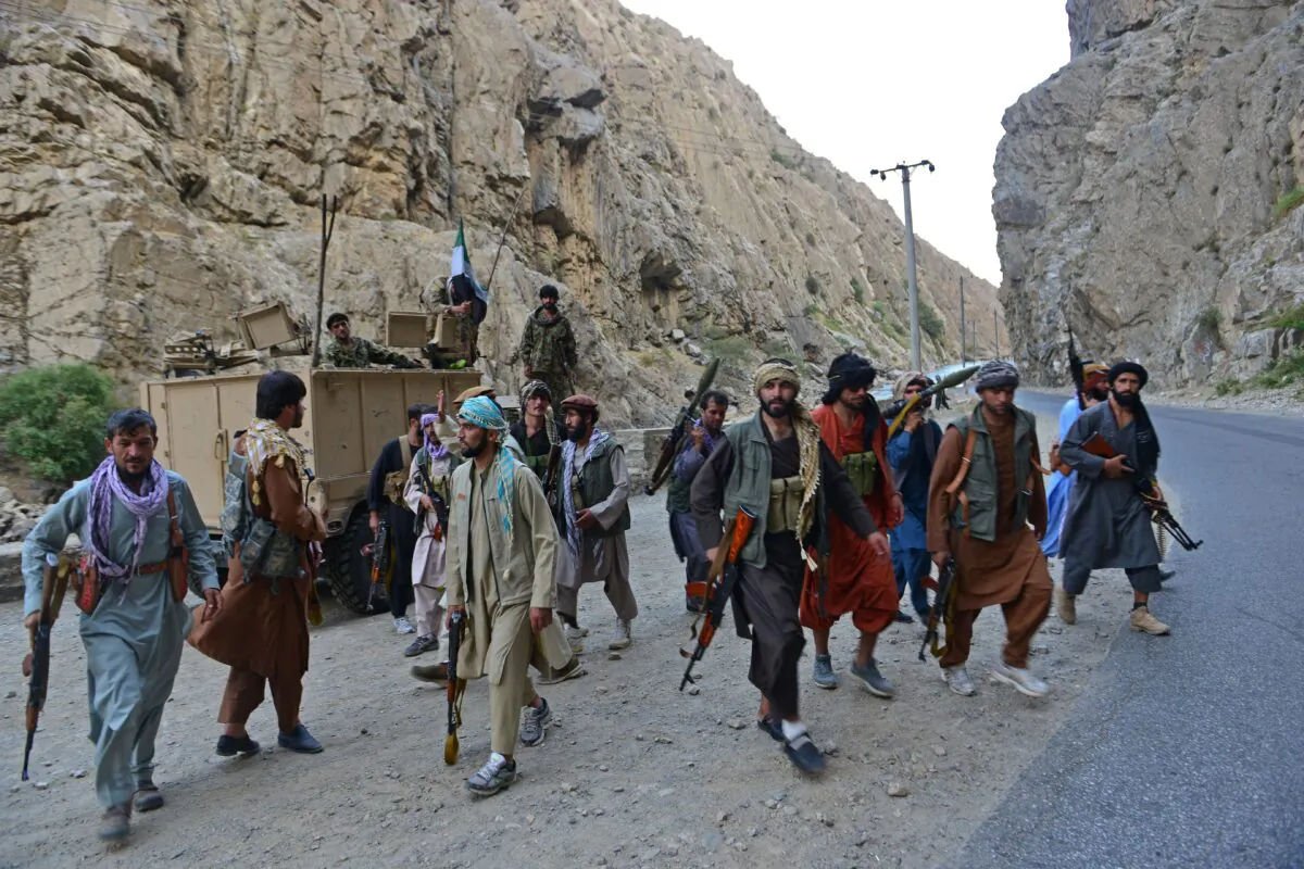 Afghan resistance movement and anti-Taliban uprising forces personnel patrol along a road in Rah-e Tang of Panjshir province on Aug. 29, 2021. (Ahmad Sahel Arman/AFP via Getty Images)