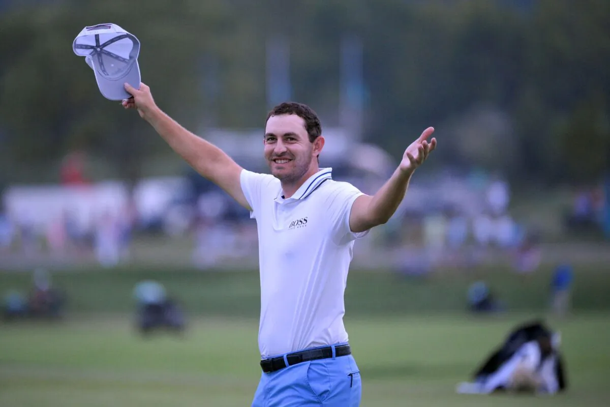 Patrick Cantlay reacts after sinking in his putt on the 18th green, the sixth playoff hole of the final round of the BMW Championship golf tournament, at Caves Valley Golf Club in Owings Mills, Md., on Aug. 29, 2021. (Nick Wass/AP Photo)