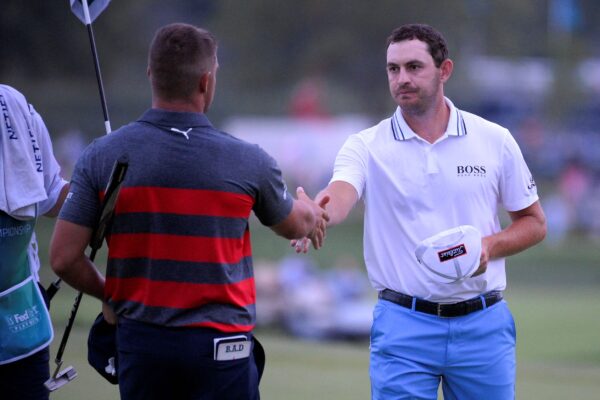 Patrick Cantlay (R) shakes hands with Bryson DeChambeau