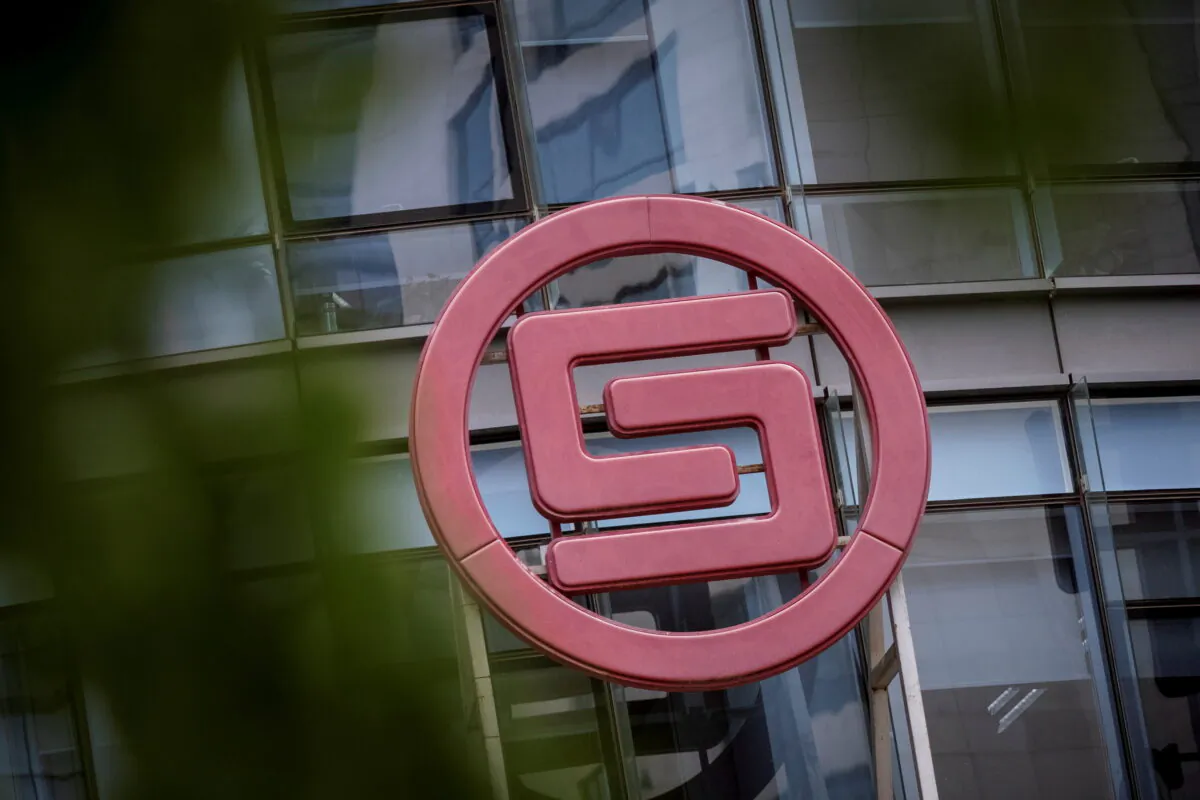The logo of China Huarong Asset Management Co.. Ltd. is seen at its office in Beijing on April 16, 2021. (Thomas Peter/File/Reuters)