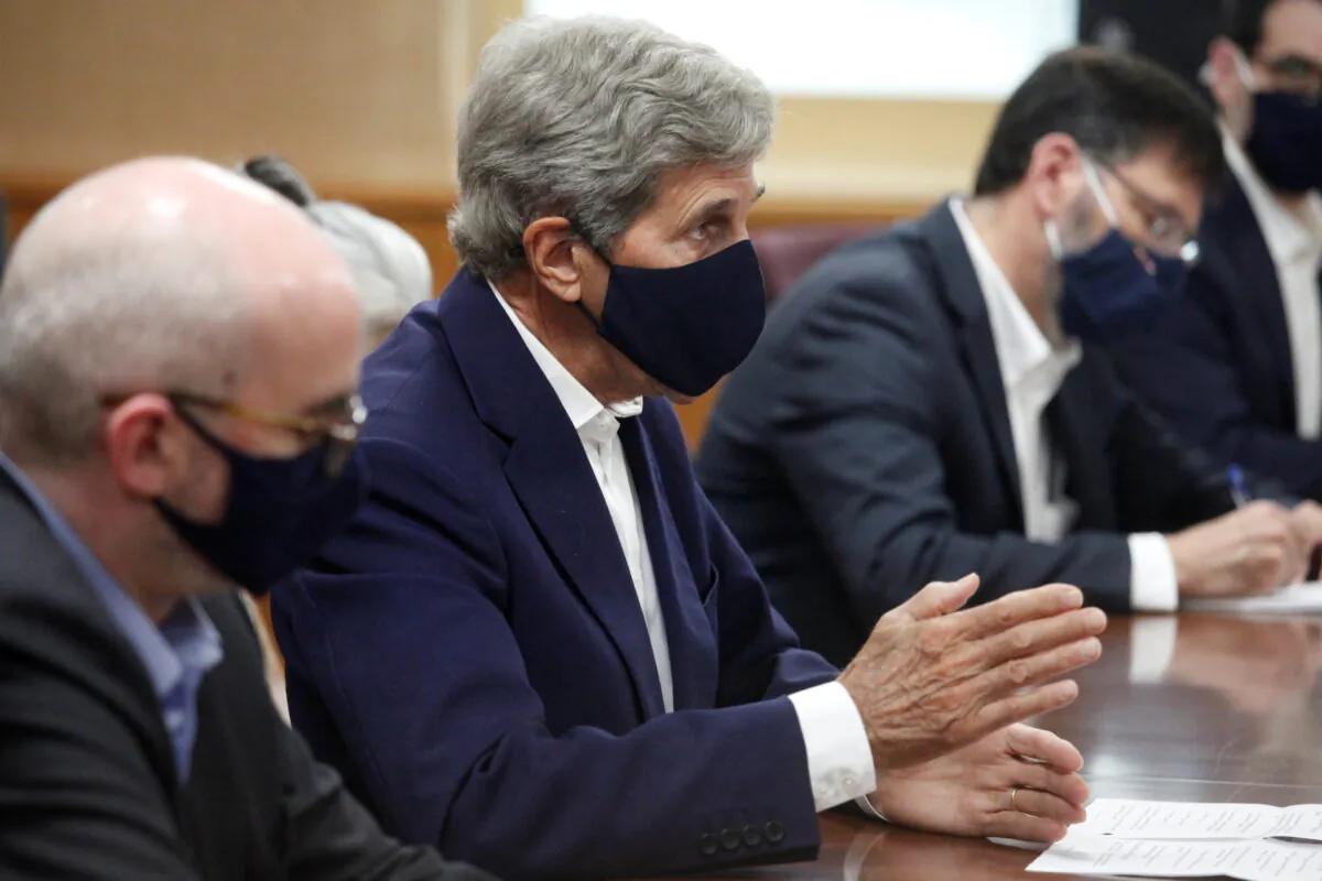 U.S. Special Presidential Envoy for Climate John Kerry talks with Japanese Minister of the Environment Shinjiro Koizumi in Tokyo, Japan, August, 31, 2021.  (Koji Sasahara/Pool via REUTERS)