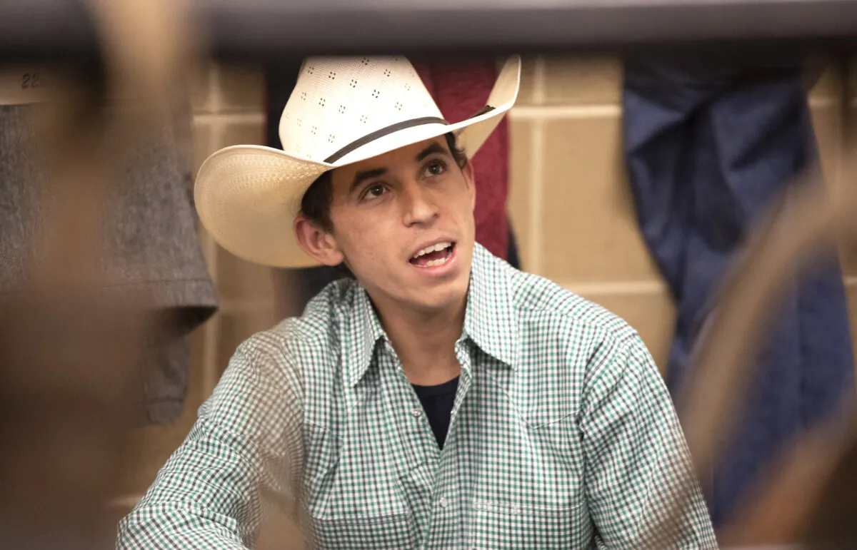 Bull rider Amadeu Campos Silva speaks in a locker room in Bangor, Maine, in March 2020. (Andre Silva/Courtesy of PBR/Bull Stock Media via AP)