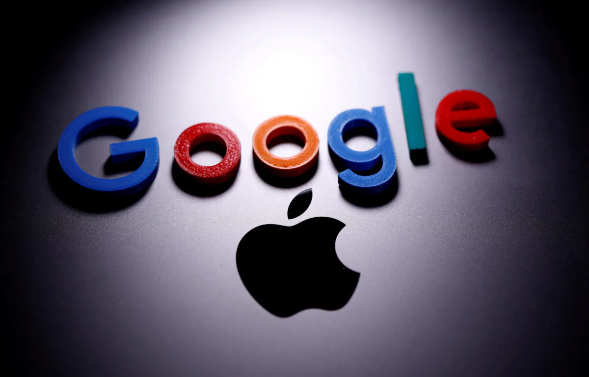 A 3D printed Google logo is placed on the Apple Macbook in this illustration taken on April 12, 2020. (Dado Ruvic/Illustration/Reuters)