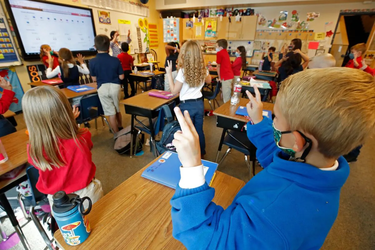 Students wear masks as a teacher instructs them at Freedom Preparatory Academy in Provo, Utah, on Sept. 10, 2020. (George Frey/AFP via Getty Images)