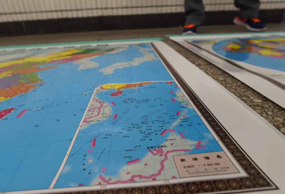 A map designed by China includes an insert with nine-dash lines showing the Chinese regime's claimed territory in the South China Sea in Beijing on June 15, 2016. (Greg Baker/AFP via Getty Images)