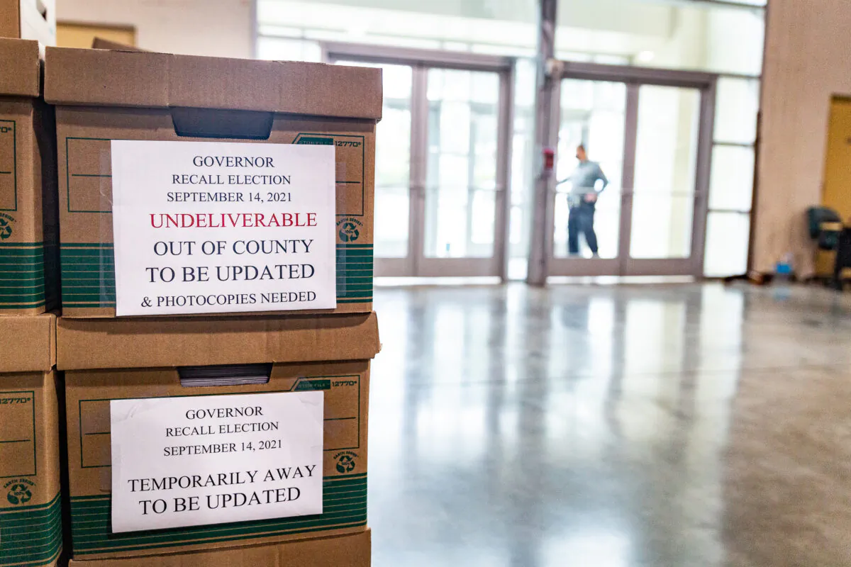 People count California recall ballot votes at a Los Angeles Registrar site at the Los Angeles Fair Grounds in Pomona, Calif., on Aug. 31, 2021. (John Fredricks/The Epoch Times)