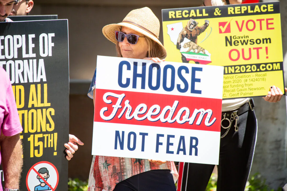 Demonstrators gather to protest coronavirus restrictions by Cal/OSHA in Santa Ana, Calif., on June 10, 2021. (John Fredricks/The Epoch Times)