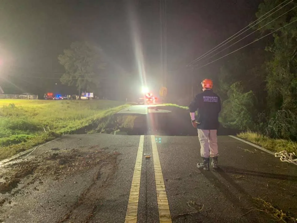 State troopers along with various other agencies at the scene of a road collapse on Highway 26 near Crossroads Road in George County, Miss., on Aug. 31, 2021. (Courtesy of Mississippi Highway Patrol)