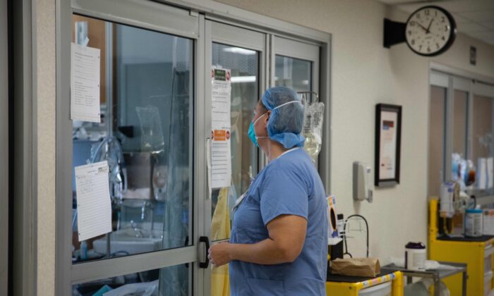 A health care professional prepares to enter a COVID-19 patient's room in the ICU at Van Wert County Hospital in Van Wert, Ohio, on Nov. 20, 2020. (Megan Jelinger/AFP via Getty Images) 