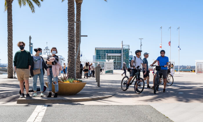 People walk along the sidewalks near the Port of San Deigo, Calif., on March 27, 2021. (John Fredricks/  Pezou)