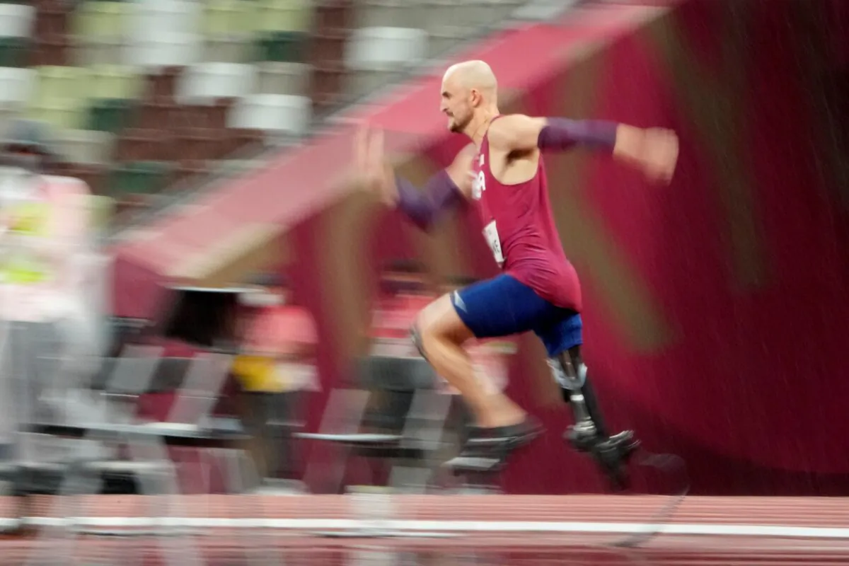 Sam Grewe of the United States competes in the men's high jump T63 final during the Tokyo 2020 Paralympics Games at the National Stadium in Tokyo, Japan, on Aug. 31, 2021. (Eugene Hoshiko/AP Photo)