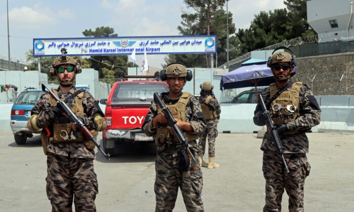 Taliban terrorists stand guard outside the Hamid Karzai International Airport after the U.S. military's withdrawal, in Kabul, Afghanistan, on Aug. 31, 2021. (Khwaja Tawfiq Sediqi/AP Photo)
