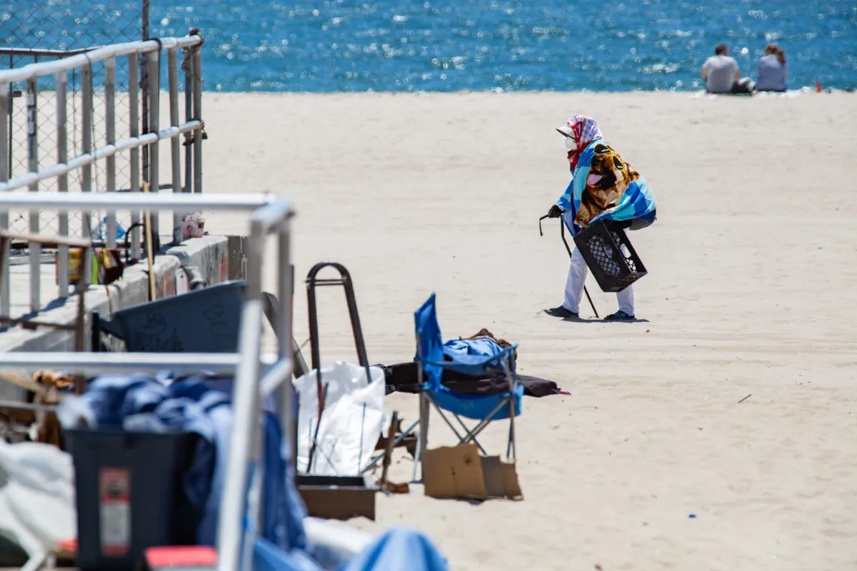 A homeless individual in Venice Beach, Calif., on June 8, 2021. (John Fredricks/The Epoch Times)