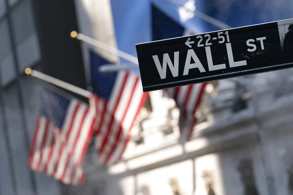 A sign for Wall Street hangs in front of the New York Stock Exchange on July 8, 2021. (Mark Lennihan/AP Photo)