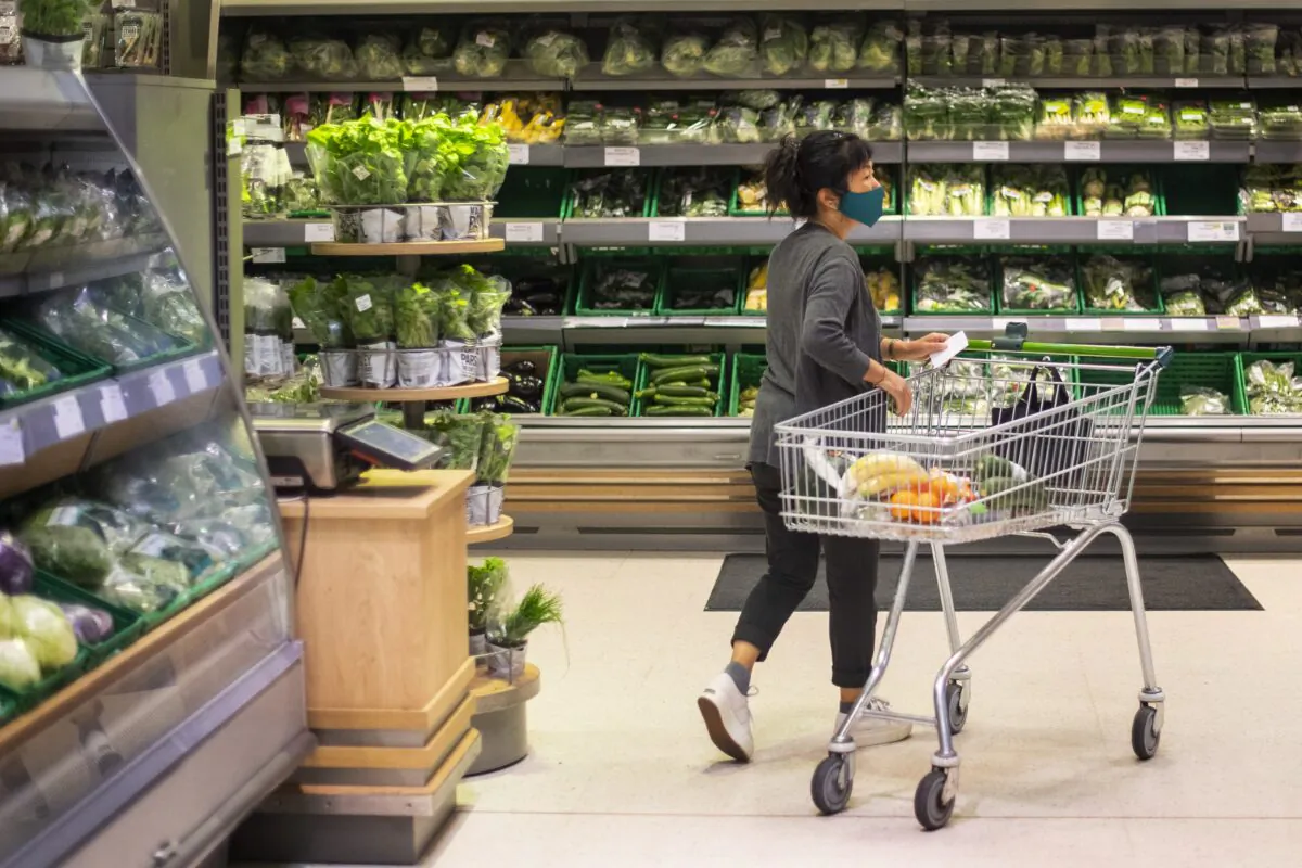 A shopper in a supermarket in east London, on July 24, 2020. (Victoria Jones/PA)