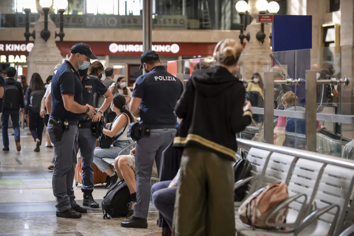 Italian police officers perform checks at Milan's Stazione Centrale train station, Italy, on Sept. 1, 2021. (Claudio Furlan/LaPresse via AP)
